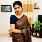 Midnight Copper Bloom Katan Silk Saree in rich black with elegant copper floral weaving and luxurious traditional woven border