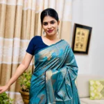 Ocean Mist Silver Zari Katan Silk Saree in teal blue featuring elegant silver floral zari weaving with a luxurious woven border and designer pallu
